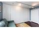 Bedroom with large wardrobe and a comfortable green sofa at 375 Ralph Mcgill Ne Blvd # 1701, Atlanta, GA 30312