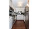 Functional kitchen featuring granite countertops, white cabinets, and stainless steel appliances at 375 Ralph Mcgill Ne Blvd # 1701, Atlanta, GA 30312