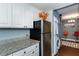Galley kitchen featuring white cabinets, granite countertops, and stainless steel appliances at 375 Ralph Mcgill Ne Blvd # 1701, Atlanta, GA 30312