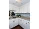 Bright kitchen features granite counters, white cabinetry and stainless steel sink and faucet at 375 Ralph Mcgill Ne Blvd # 1701, Atlanta, GA 30312