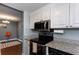 Kitchen with white cabinets, stainless steel appliances, and granite countertops at 375 Ralph Mcgill Ne Blvd # 1701, Atlanta, GA 30312