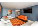 Spacious living room featuring sofas, a large television, and an orange patterned rug at 375 Ralph Mcgill Ne Blvd # 1701, Atlanta, GA 30312
