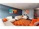 Open living room featuring sofas, colorful artwork and an orange patterned rug at 375 Ralph Mcgill Ne Blvd # 1701, Atlanta, GA 30312