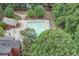 Community pool surrounded by trees, offering a serene and private retreat for relaxation and recreation at 375 Ralph Mcgill Ne Blvd # 1701, Atlanta, GA 30312