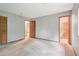 Bedroom with multiple doorways, neutral walls and carpeted floors at 497 Fire Fly Dr, Tucker, GA 30084