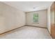 Bright bedroom featuring a window for natural light and carpet flooring at 497 Fire Fly Dr, Tucker, GA 30084