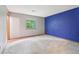 Spacious bedroom with large window and painted accent wall at 497 Fire Fly Dr, Tucker, GA 30084