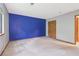 Bedroom features accent wall, closet, and natural light at 497 Fire Fly Dr, Tucker, GA 30084