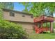 View of exterior home and yard, highlighting the inviting two-story deck space at 497 Fire Fly Dr, Tucker, GA 30084