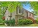 Charming home with stone accents, bay window, and expansive backyard with trees at 497 Fire Fly Dr, Tucker, GA 30084