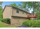 Home's exterior with a two-story deck surrounded by well-maintained landscaping at 497 Fire Fly Dr, Tucker, GA 30084