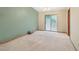 Living room featuring green wall and sliding glass doors to outdoor area at 497 Fire Fly Dr, Tucker, GA 30084