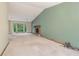 Bright living room with vaulted ceiling, fireplace, and large windows facing the yard at 497 Fire Fly Dr, Tucker, GA 30084