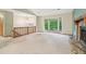 Spacious living room with stone fireplace and large windows offering ample natural light at 497 Fire Fly Dr, Tucker, GA 30084
