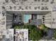 Top-down aerial view showcasing a complex with a pool, parking lots, rooftop HVAC units, and landscaping at 878 Peachtree St # 601, Atlanta, GA 30309