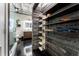 Modern bathroom featuring wood plank wall, custom shoe racks, a glass enclosed shower, and contemporary fixtures at 878 Peachtree St # 601, Atlanta, GA 30309