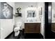 Stylish bathroom with updated vanity, marble countertop, decorative artwork, and modern lighting fixtures at 878 Peachtree St # 601, Atlanta, GA 30309