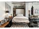 Stylish bedroom with a Murphy bed, decorative rug, artistic decor, and city view, ideal for maximizing space at 878 Peachtree St # 601, Atlanta, GA 30309