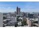 Panoramic city view featuring prominent skyscrapers and lush green trees amidst the urban landscape at 878 Peachtree St # 601, Atlanta, GA 30309