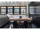 A dining area with exposed ceiling, industrial lighting and large window views to the outside at 878 Peachtree St # 601, Atlanta, GA 30309
