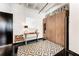 Hallway featuring a Murphy bed, modern decor, and sleek black floors at 878 Peachtree St # 601, Atlanta, GA 30309