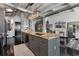 Spacious kitchen island with granite countertop and seating. Open concept design leading to a living area at 878 Peachtree St # 601, Atlanta, GA 30309
