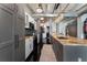 Modern kitchen featuring updated appliances, gray cabinetry, and decorative lighting fixtures at 878 Peachtree St # 601, Atlanta, GA 30309