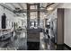 Open concept living area connecting the living room, dining area, and kitchen, with industrial-style elements at 878 Peachtree St # 601, Atlanta, GA 30309