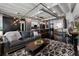 Open-concept living area featuring high ceilings, a modern kitchen, and dark-stained concrete floors at 878 Peachtree St # 601, Atlanta, GA 30309