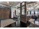 Open-concept living space with exposed ductwork, polished floors, and large windows showcasing urban views at 878 Peachtree St # 601, Atlanta, GA 30309