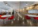 Bright and airy lobby area with tables, chairs, and shiny floors, decorated with unique wooden walls at 878 Peachtree St # 601, Atlanta, GA 30309