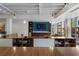 This lounge area offers a shared work space in addition to the kitchen and entertainment area at 878 Peachtree St # 601, Atlanta, GA 30309