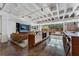 The well-lit lounge area has a kitchen-like space, stylish seating, and an entertainment center for residents at 878 Peachtree St # 601, Atlanta, GA 30309