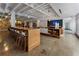 Expansive lounge area featuring a long communal table with stools, offering a stylish social and working space at 878 Peachtree St # 601, Atlanta, GA 30309