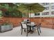 Outdoor patio area with an umbrella, a grill, and table seating surrounded by a wood fence at 878 Peachtree St # 601, Atlanta, GA 30309