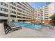 Inviting pool area with lounge chairs, set in a courtyard beside the condo building at 878 Peachtree St # 601, Atlanta, GA 30309