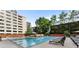 The swimming pool area has plenty of lounge chairs and lovely landscaping in this outdoor shot at 878 Peachtree St # 601, Atlanta, GA 30309