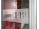 Elegant etched glass signage for '878 Peachtree Lofts' at building entrance at 878 Peachtree St # 601, Atlanta, GA 30309