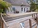 View of the back of the house with an elevated back deck perfect for entertaining guests at 1645 Four Notch Rd, Carrollton, GA 30116