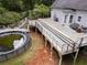 Large multi-level deck with above-ground pool offering space for outdoor entertaining at 1645 Four Notch Rd, Carrollton, GA 30116