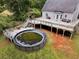 View of the backyard featuring an above ground pool and an elevated deck at 1645 Four Notch Rd, Carrollton, GA 30116