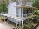 Charming two-story home featuring a raised deck, complemented by a two-car garage at 1645 Four Notch Rd, Carrollton, GA 30116