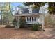Charming exterior view of home featuring a full front porch and a neatly landscaped yard at 1645 Four Notch Rd, Carrollton, GA 30116