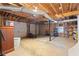 Spacious garage featuring 2 bays, exposed beams, and shelving for storage at 1645 Four Notch Rd, Carrollton, GA 30116