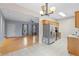 Open kitchen with dining area featuring wooden cabinets and stainless steel appliances at 1645 Four Notch Rd, Carrollton, GA 30116