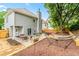 Well-maintained backyard with a patio, hammock, and privacy fence, creating a relaxing outdoor space at 2865 Winter Rose Ct, Dunwoody, GA 30360