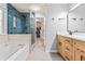 Beautiful bathroom featuring double vanity, modern fixtures, walk-in shower, and luxurious bathtub at 2865 Winter Rose Ct, Dunwoody, GA 30360