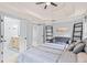 Comfortable bedroom with a neutral palette, opening to a bright bathroom with double vanity at 2865 Winter Rose Ct, Dunwoody, GA 30360