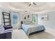 Spacious bedroom with a tray ceiling, a ceiling fan, and plenty of natural light at 2865 Winter Rose Ct, Dunwoody, GA 30360
