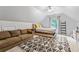 Bonus room with a brown couch, bed, and geometric rug; functional as a second living space at 2865 Winter Rose Ct, Dunwoody, GA 30360